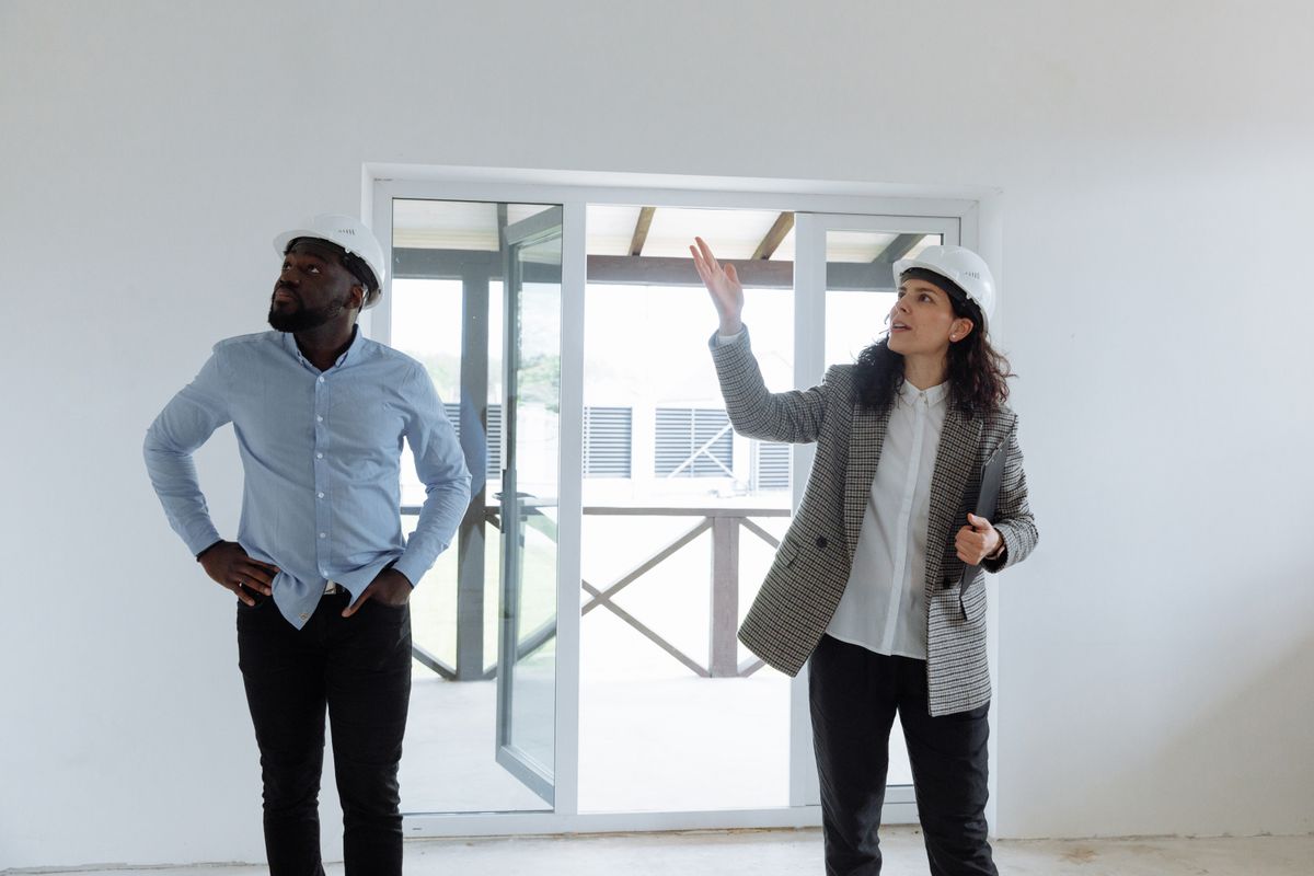 Contractor and client reviewing finished interior on a final walkthrough